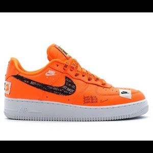 Neon orange Nike airforce 1’s low.
